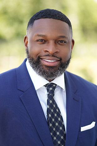 smiling man in a suit